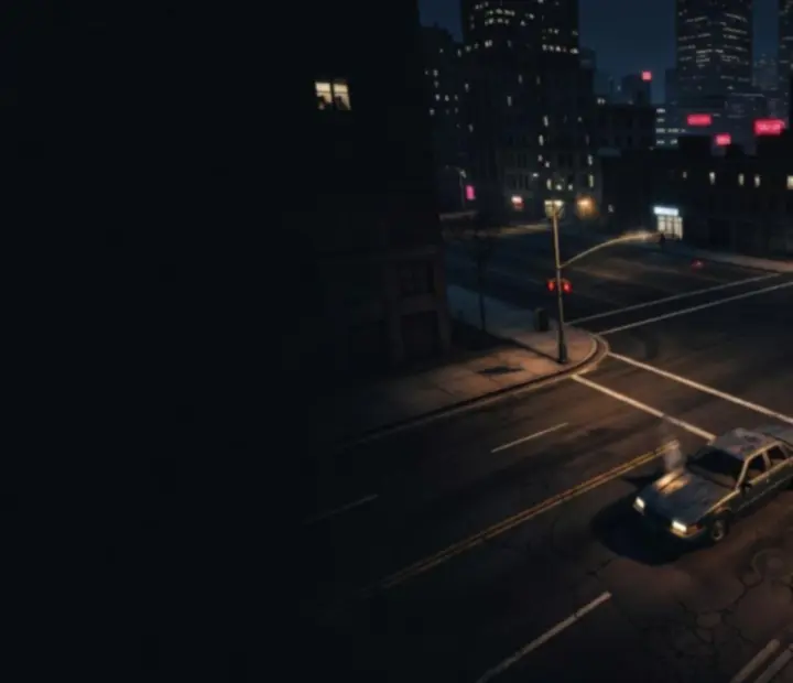 Nighttime city streets with vehicles moving through an urban action scene